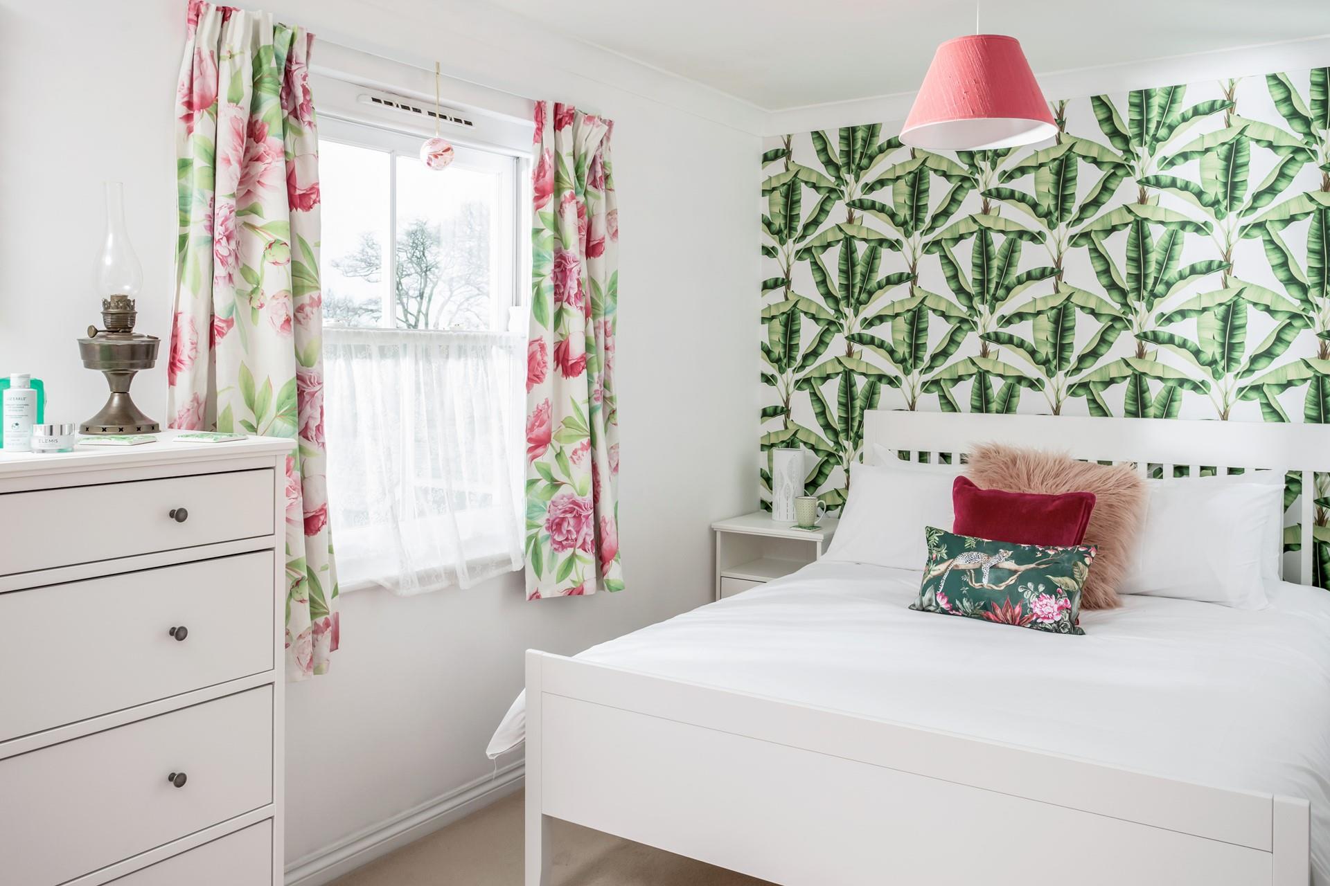 The bedroom has bright decor and is a relaxing base to come back to each day.