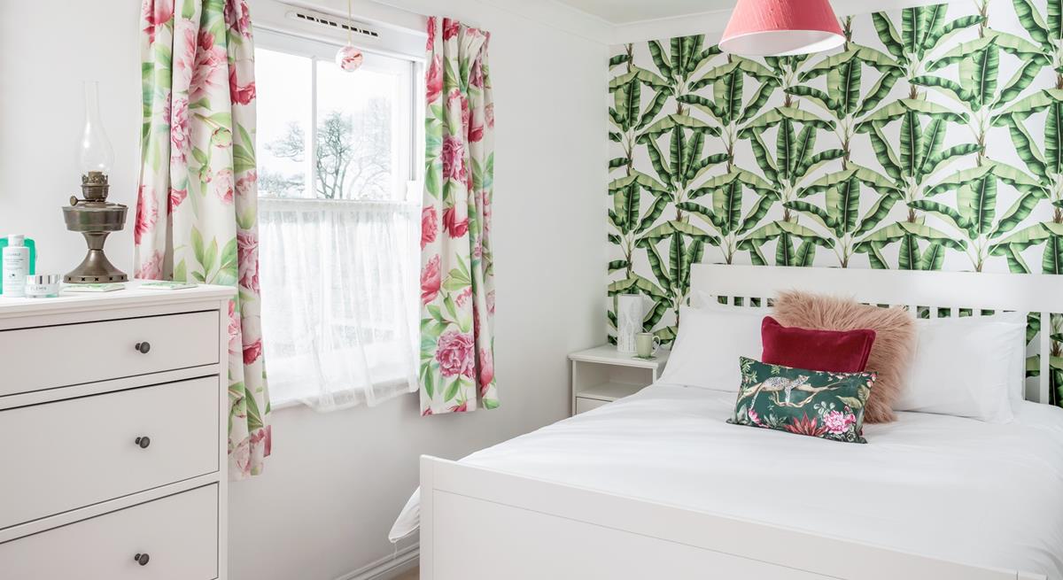 The bedroom has bright decor and is a relaxing base to come back to each day.