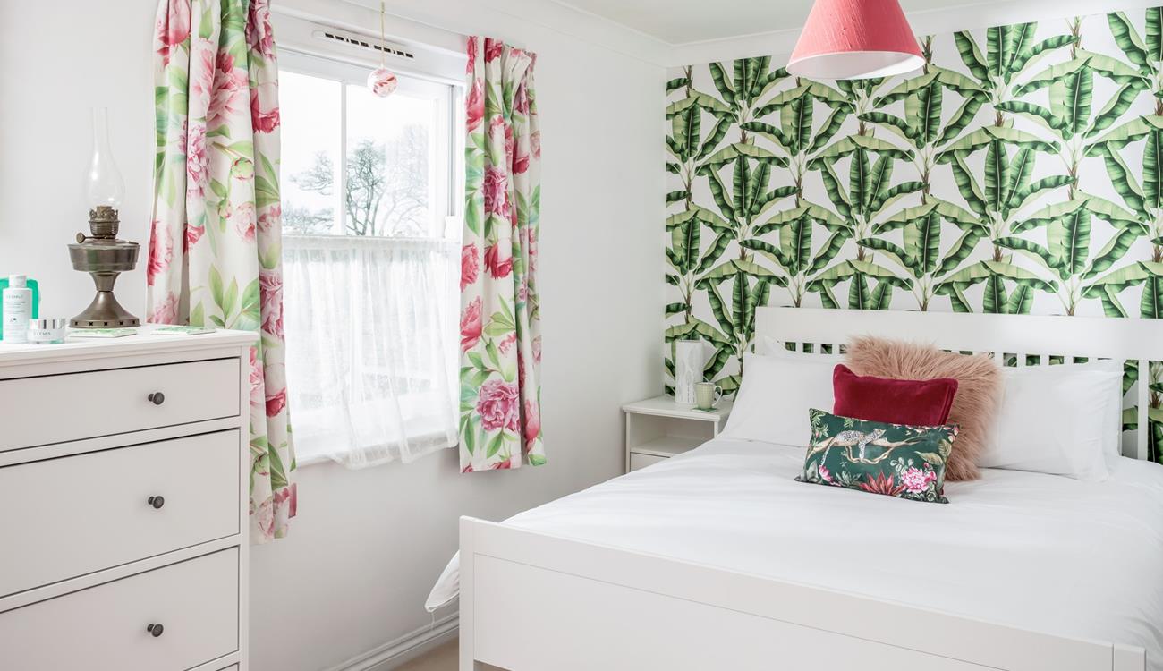 The bedroom has bright decor and is a relaxing base to come back to each day.