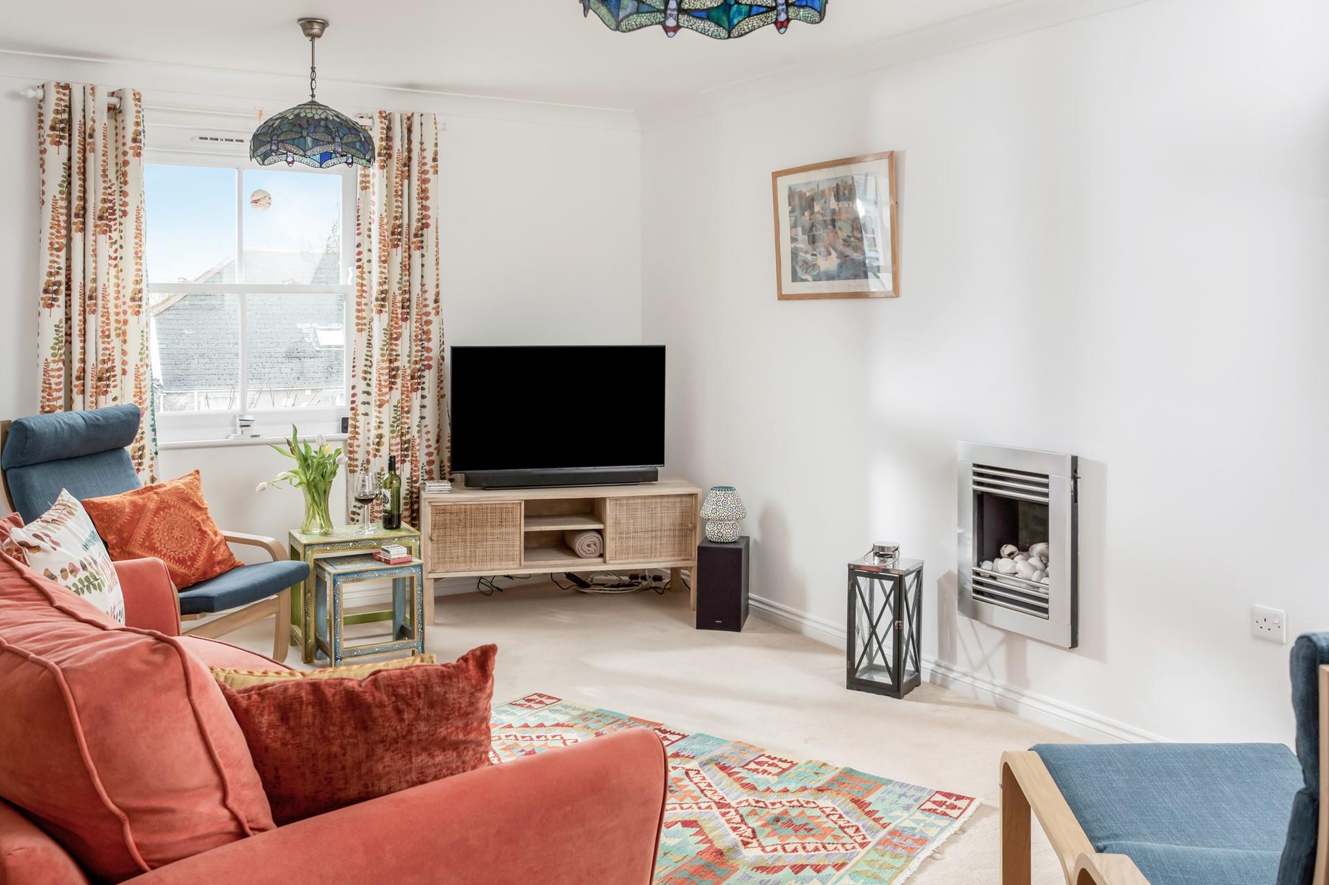 The cosy sitting room is perfect for nights in with a movie on the TV.