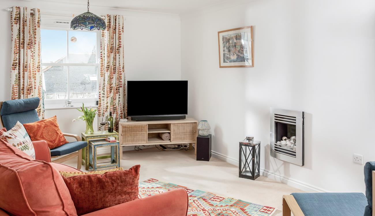 The cosy sitting room is perfect for nights in with a movie on the TV.
