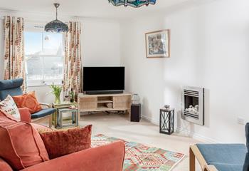 The cosy sitting room is perfect for nights in with a movie on the TV.
