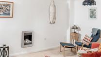 The sitting room has bright interiors making for the perfect space to relax.