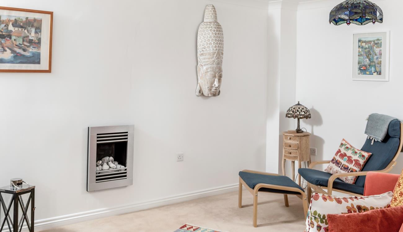 The sitting room has bright interiors making for the perfect space to relax.