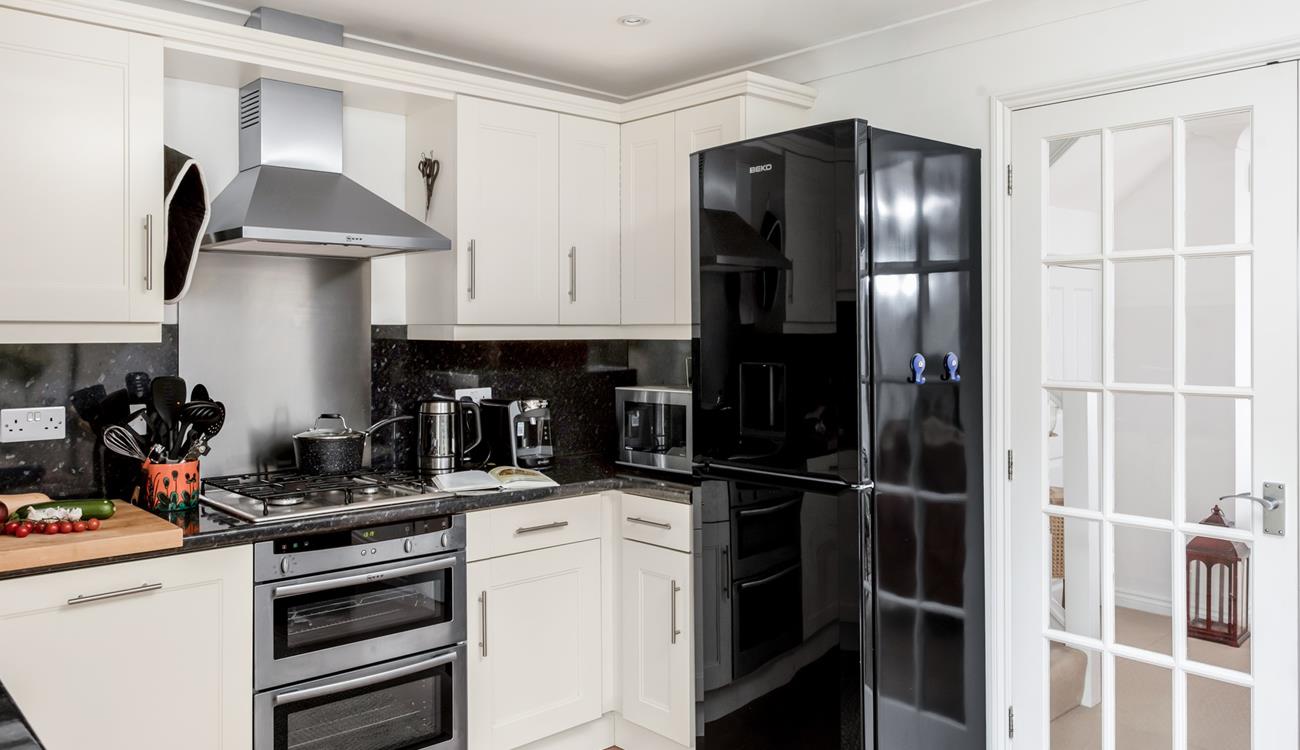 The well-equipped kitchen provides ample space to cook tasty meals.