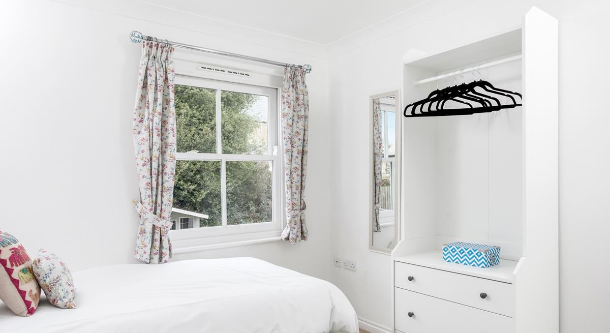 Open the curtains and check the weather for the day.