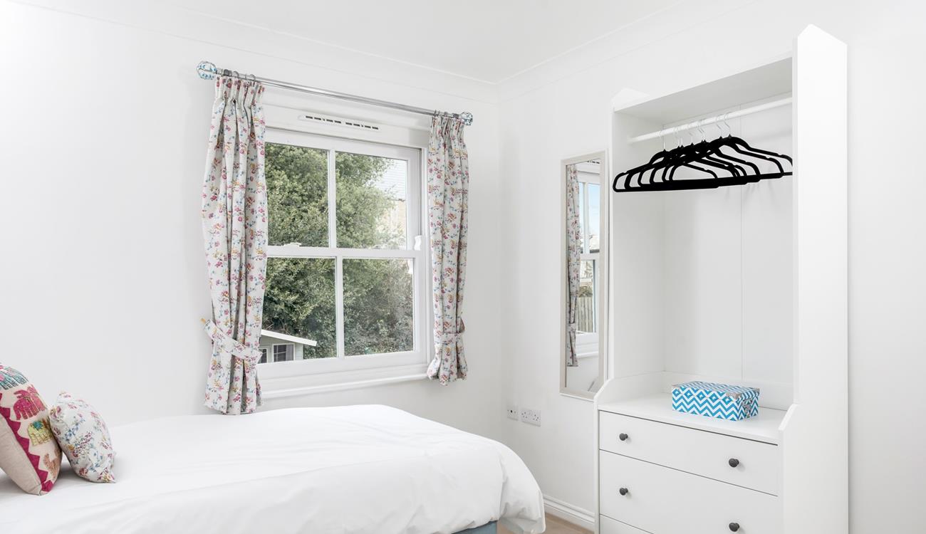 Open the curtains and check the weather for the day.