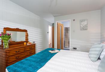 Bedroom 2 has a luxurious king size bed and an en suite to get ready for the day.