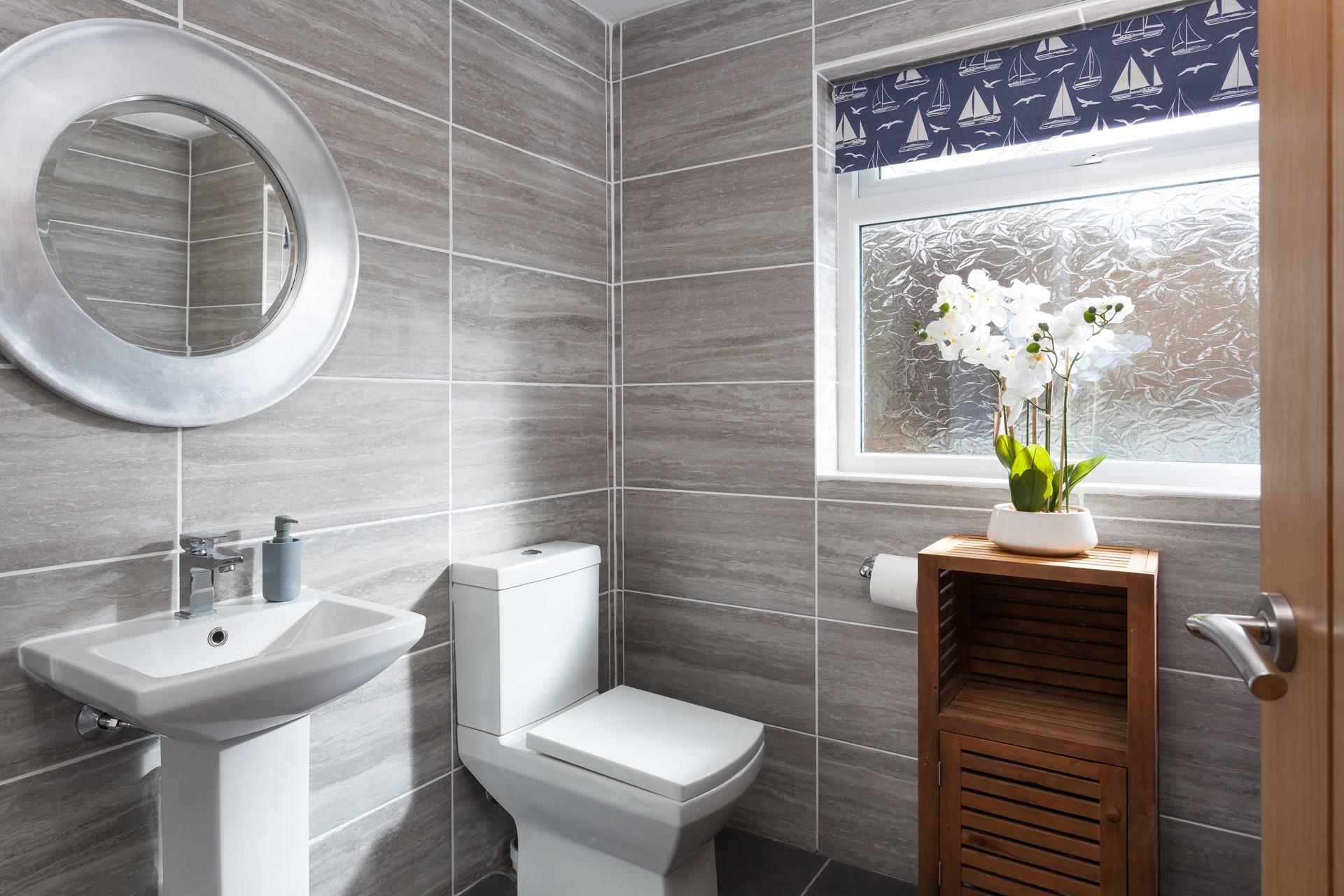 The bathroom is stylish and the perfect space to get ready for the day.