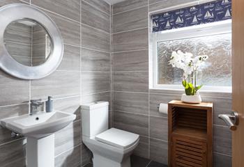 The bathroom is stylish and the perfect space to get ready for the day.