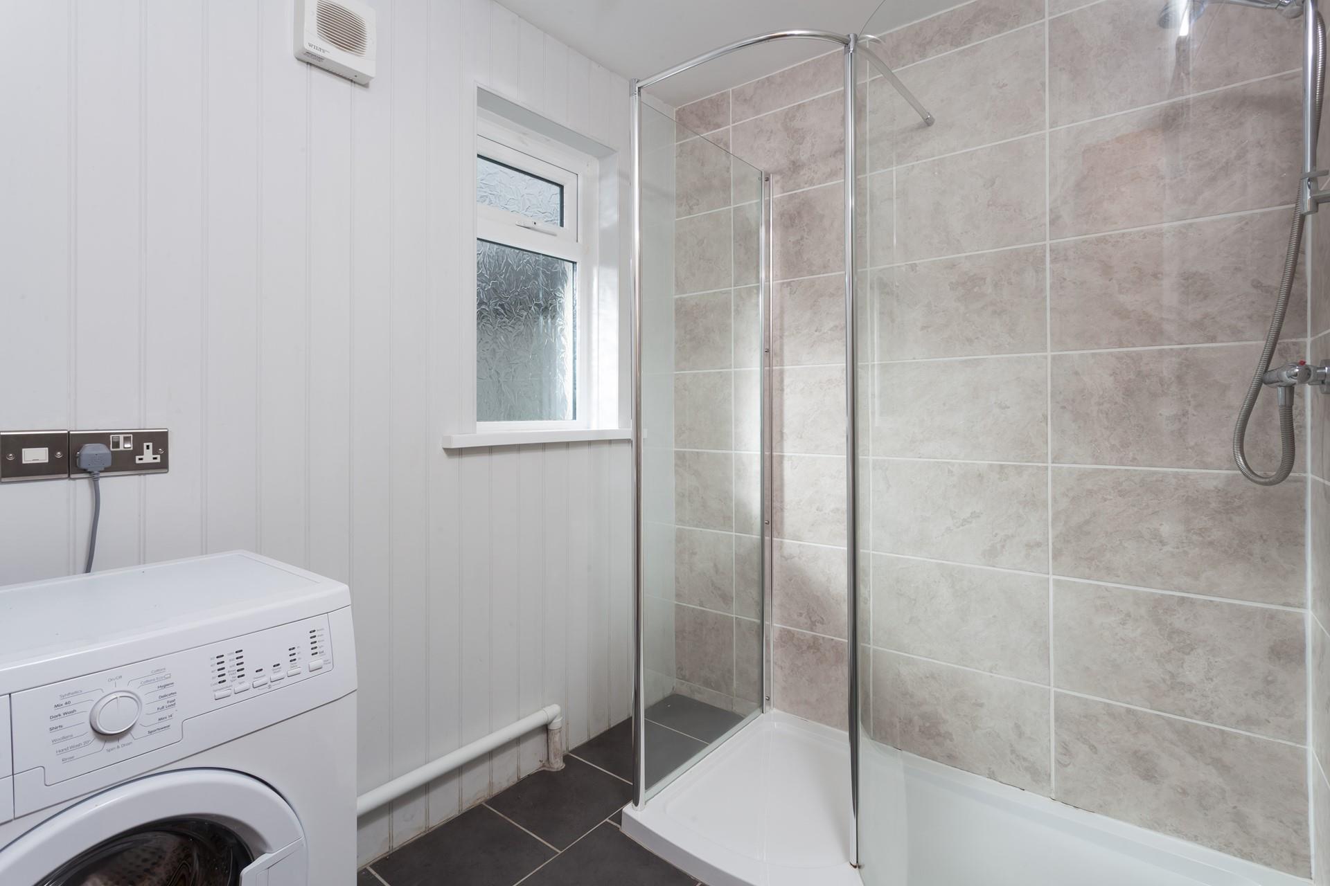 The shower room is perfect for rinsing off the sand after a day of exploring the local beaches of the south coast.
