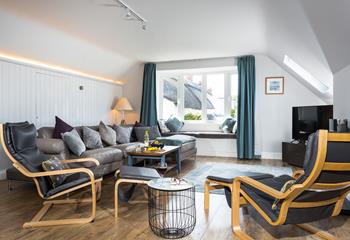 Unwind in the spacious living area after a day walking the nearby coast path.