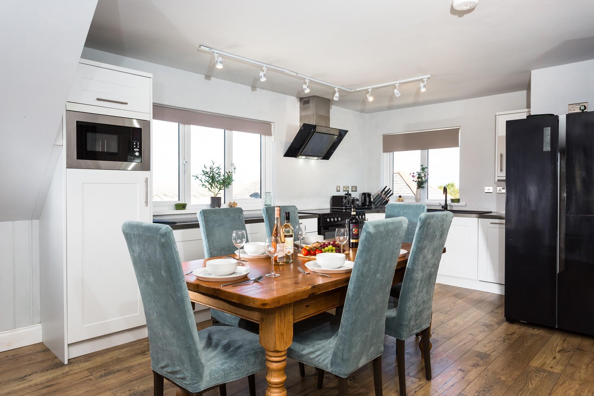 Enjoy family dinners around the dining table planning your next Cornish adventure.