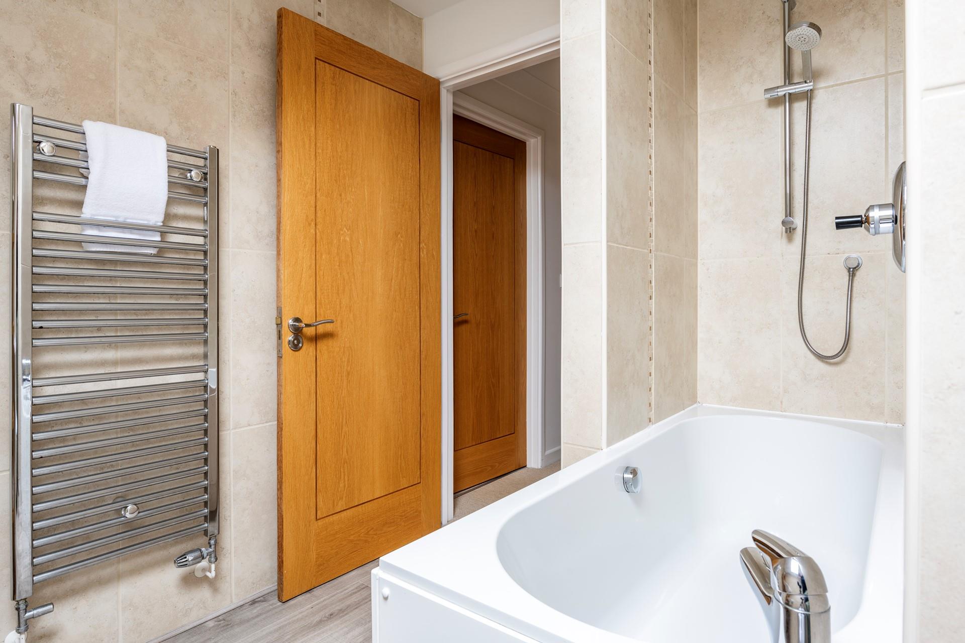 Wash off sandy toes in the shower after a day on blue flag Carbis Bay beach.