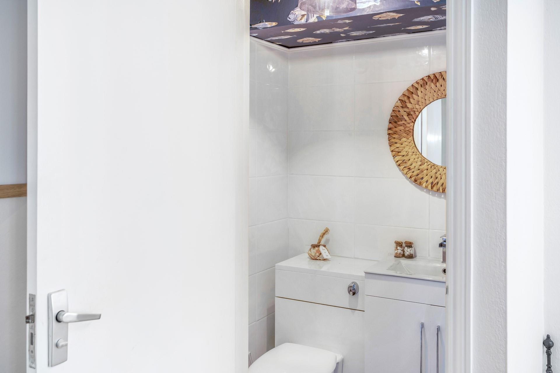 A handy downstairs cloakroom.