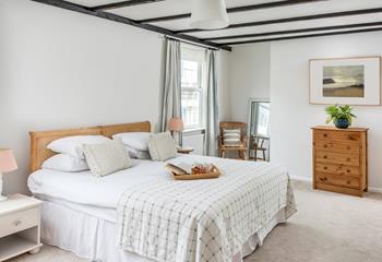 A serene bedroom, perfect for a good night's sleep after walking the coast path or exploring the local beaches.