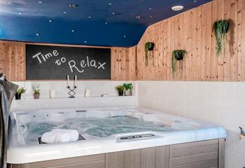 Indulge in a relaxing soak in the hot tub after walking the coast path.