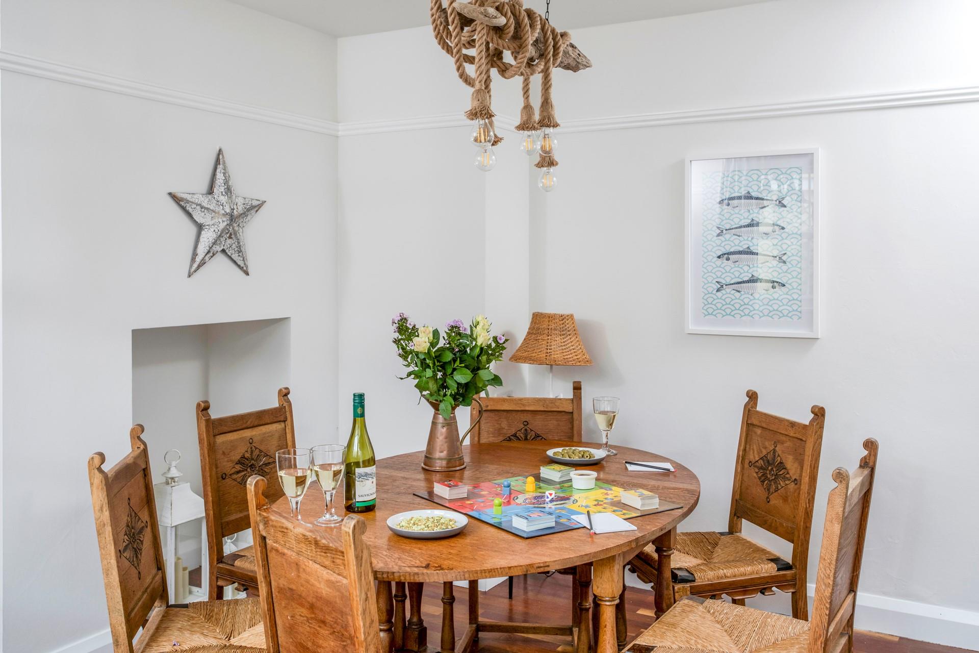 The dining area is simple, yet stylish mixing modern decor with traditional furniture.