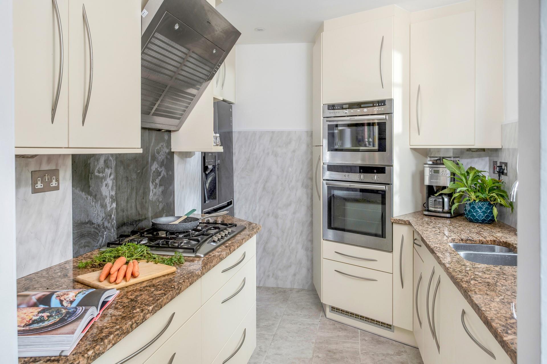 The galley-style kitchen has all the mod cons you need.