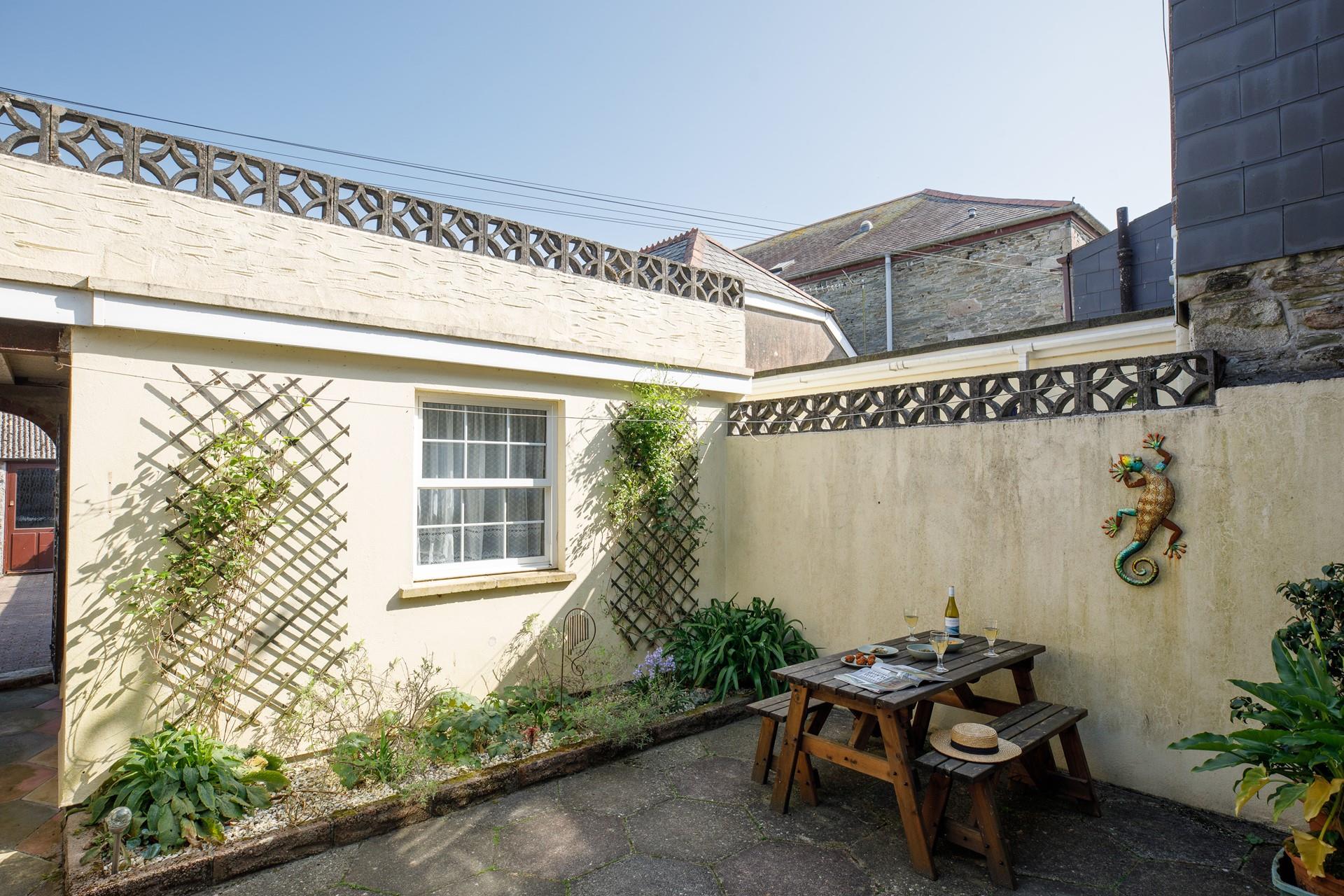 Sip a glass of wine whilst soaking up the warm sun.