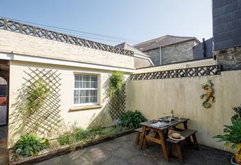 Sip a glass of wine whilst soaking up the warm sun.