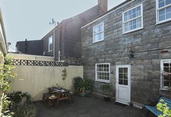 Dine alfresco in the secluded courtyard.