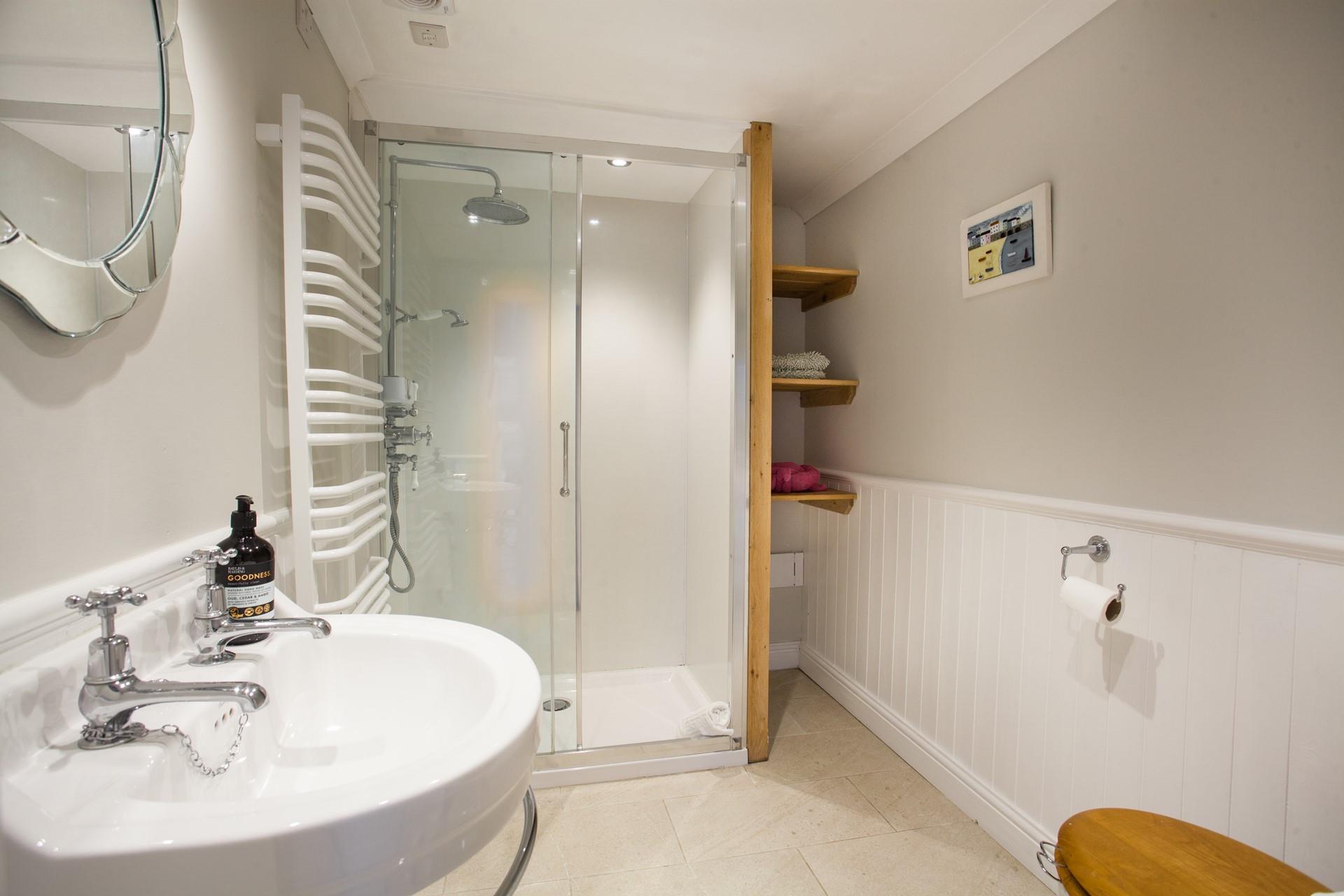 Wash off sandy toes in the shower after a day of exploring Cornwall.