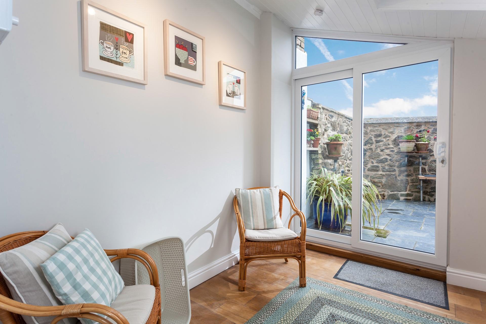 The sunroom is the perfect spot for a cup of tea and a good book.