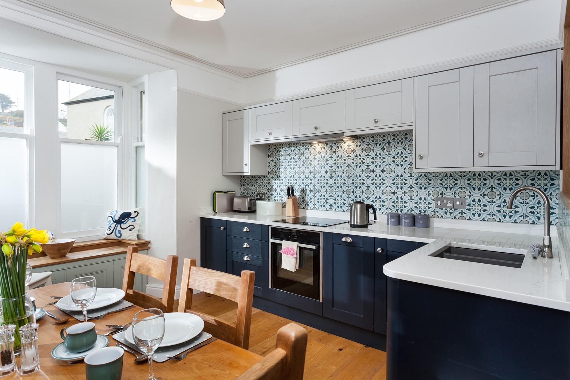 The kitchen is modern, stylish and fully equipped for cooking up a storm.