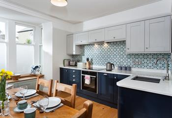 The kitchen is modern, stylish and fully equipped for cooking up a storm.