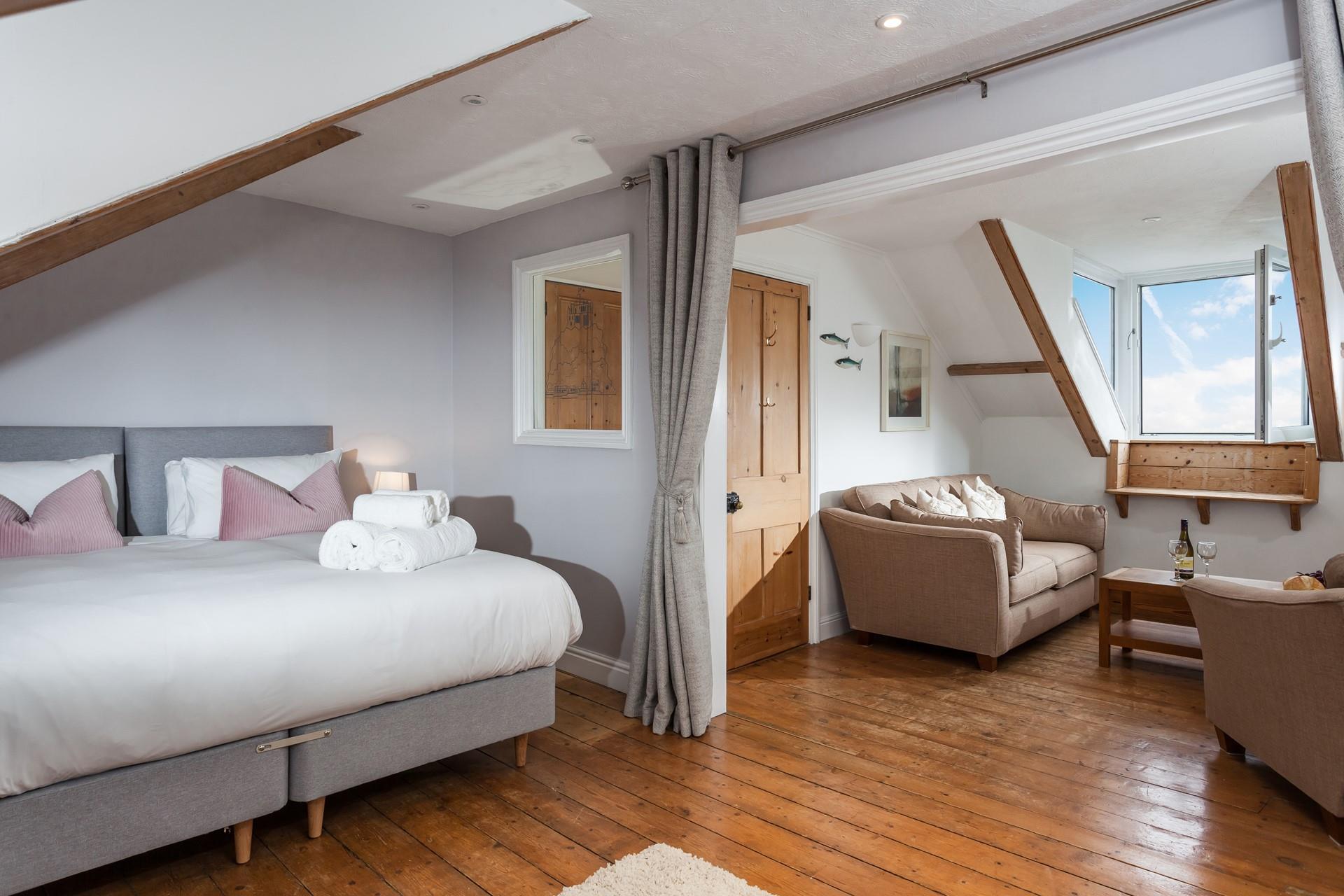 Bedroom 3 is super spacious with an additional seating area.