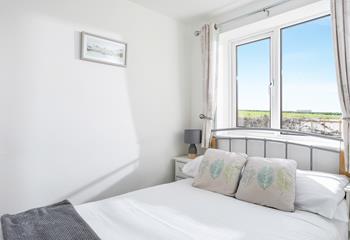 After watching the sunset at Watergate Bay, settle into the soft sheets of the double bed.