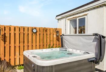 Unwind in the bubbly hot tub as the sun comes down.