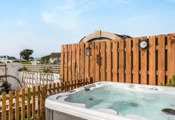 Sip a glass of wine and relax in the hot tub, pure bliss!