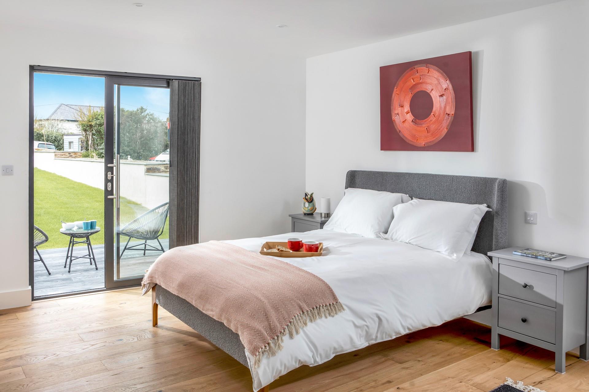 Watch the sunset over Widemouth Bay and wander back to this contemporary home.