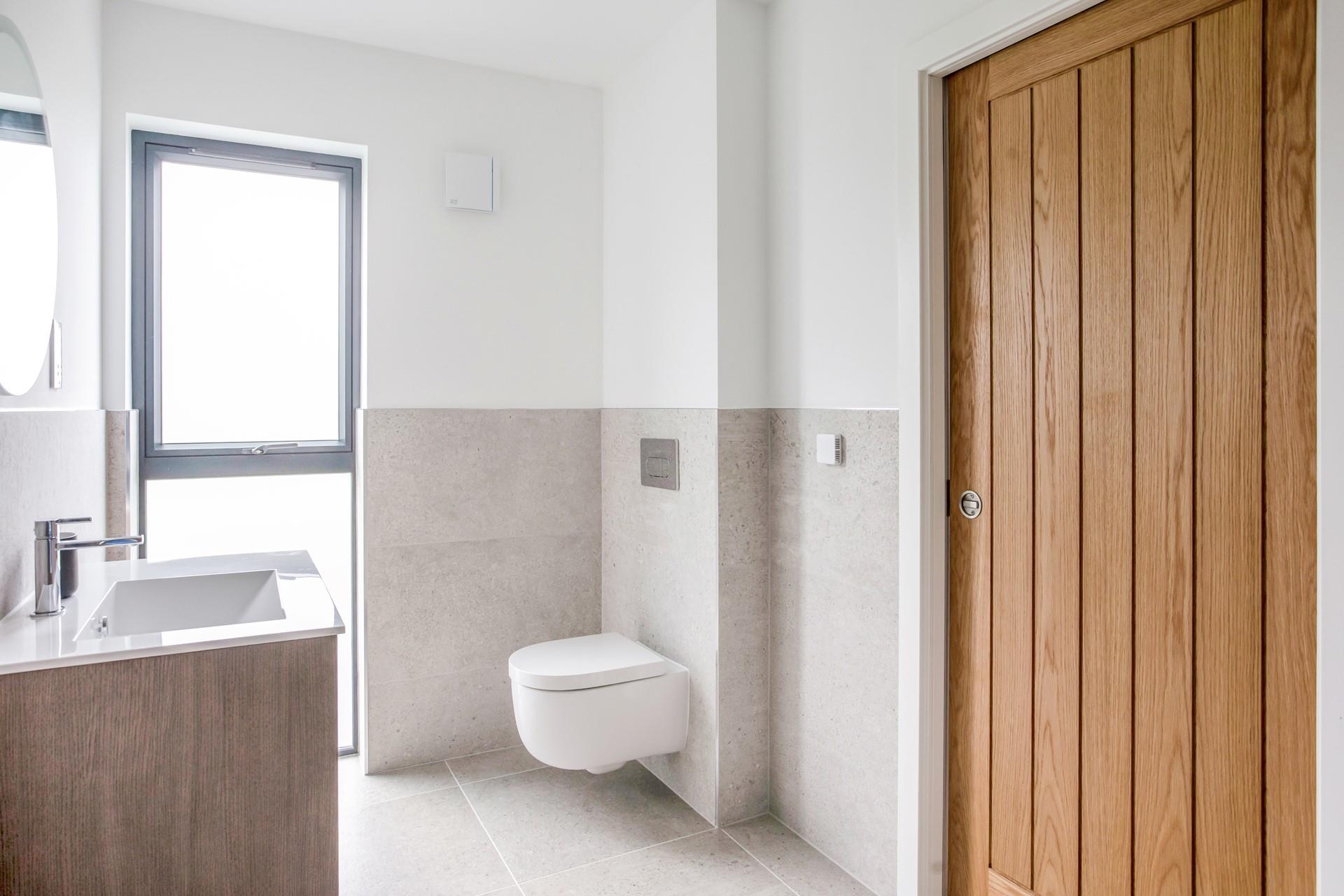 The bathroom is a modern space to get ready each morning.