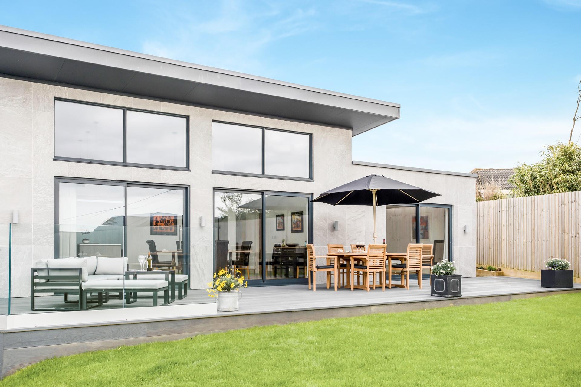 Watch the little ones and furry friends play in the garden after a day on Widemouth Bay beach.