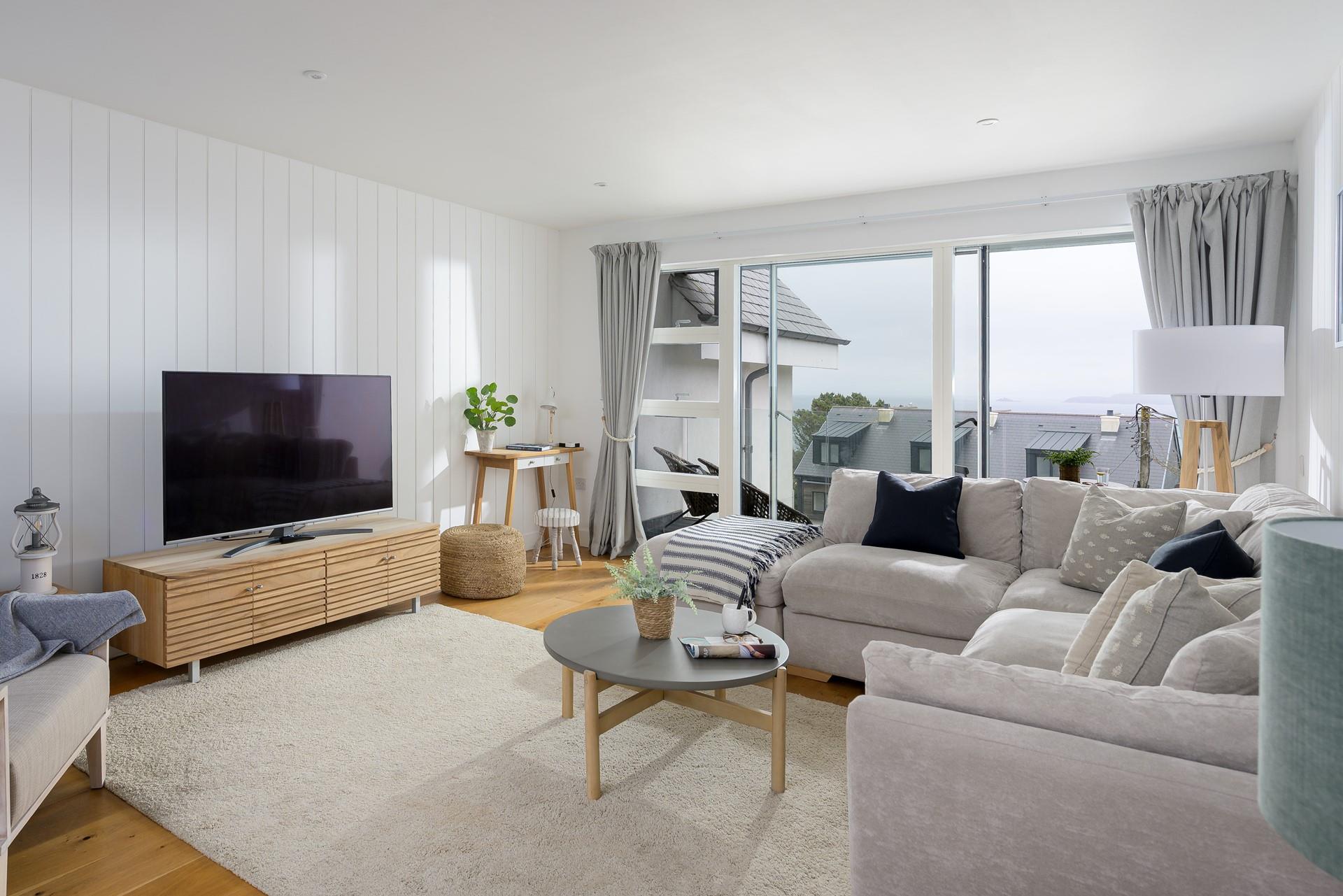 Sink into the sumptuous sofa after enjoying a drink on the balcony.