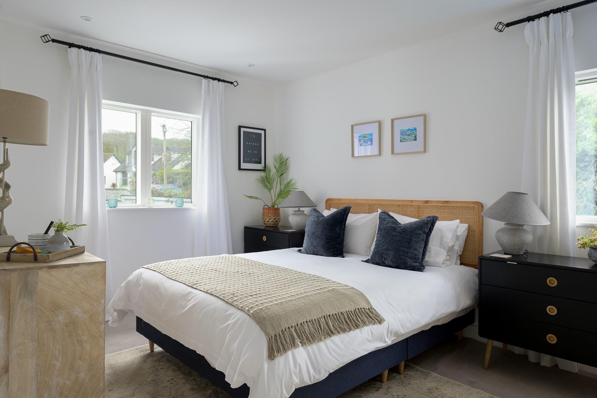 Bedroom 2 has a spacious king size bed and stylish furnishings.