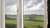 Countryside and sea views can be enjoyed from Trelowarren Barn.