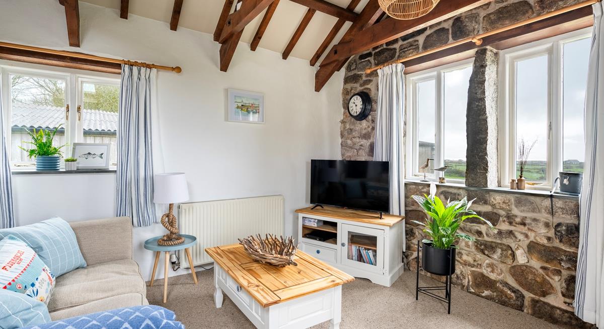 Relax and unwind with your loved one in the cosy sitting room.