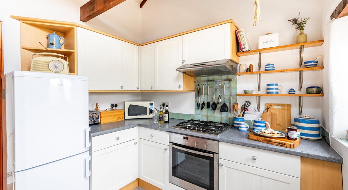 The kitchen is well-equipped for rustling up romantic meals and packing day trip picnics.