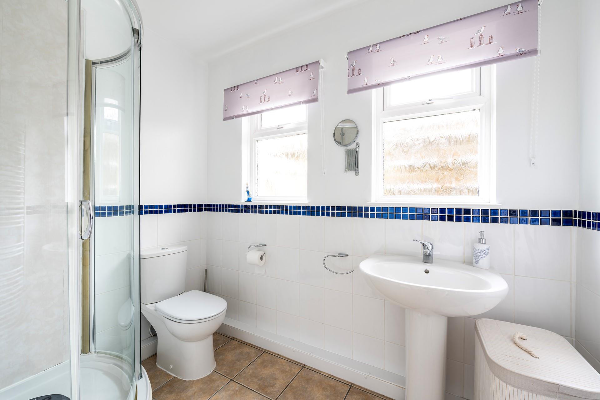 Wash off sandy toes in the shower after a day on Praa Sands beach.