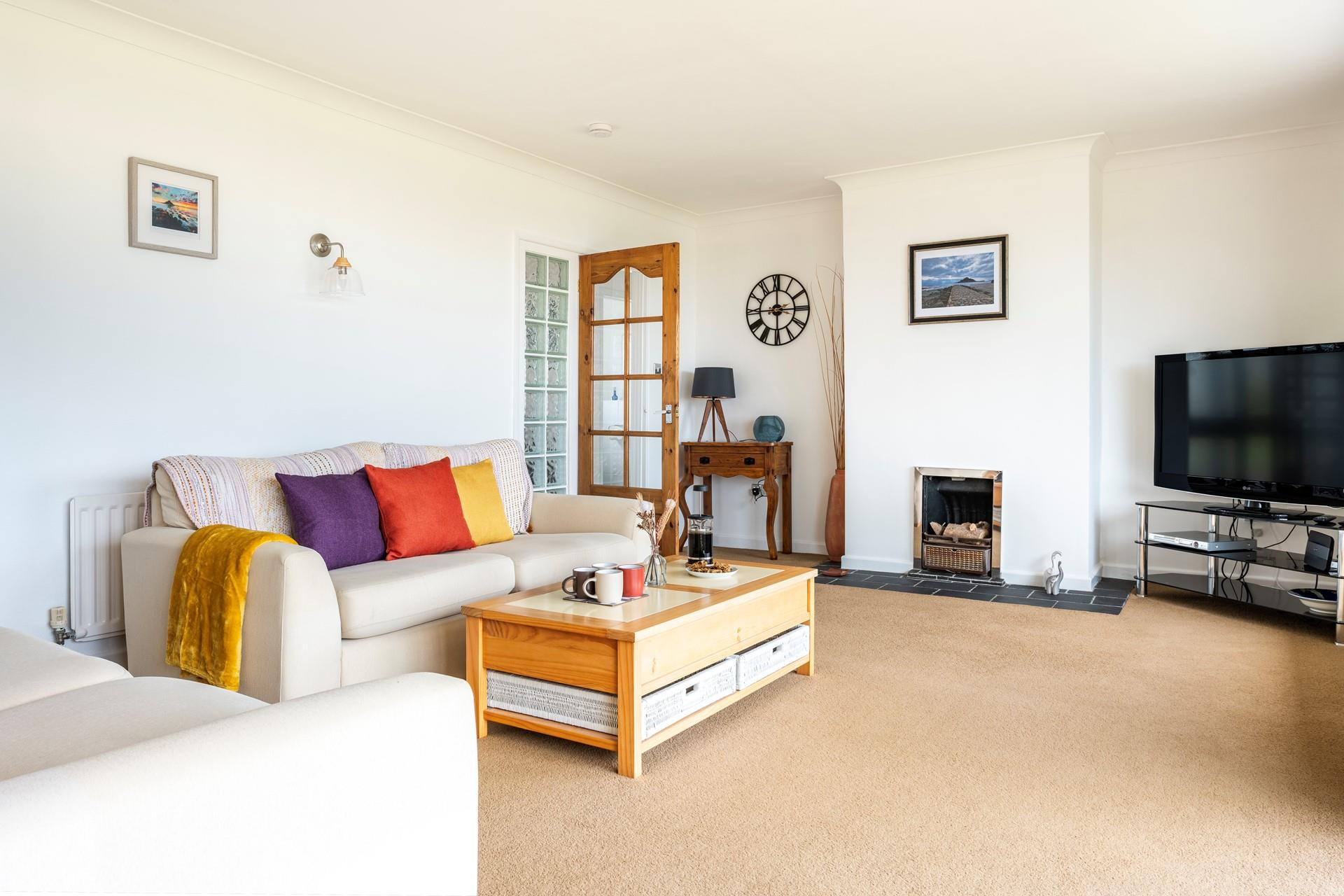 Enjoy quality time together as a family in the spacious sitting room.