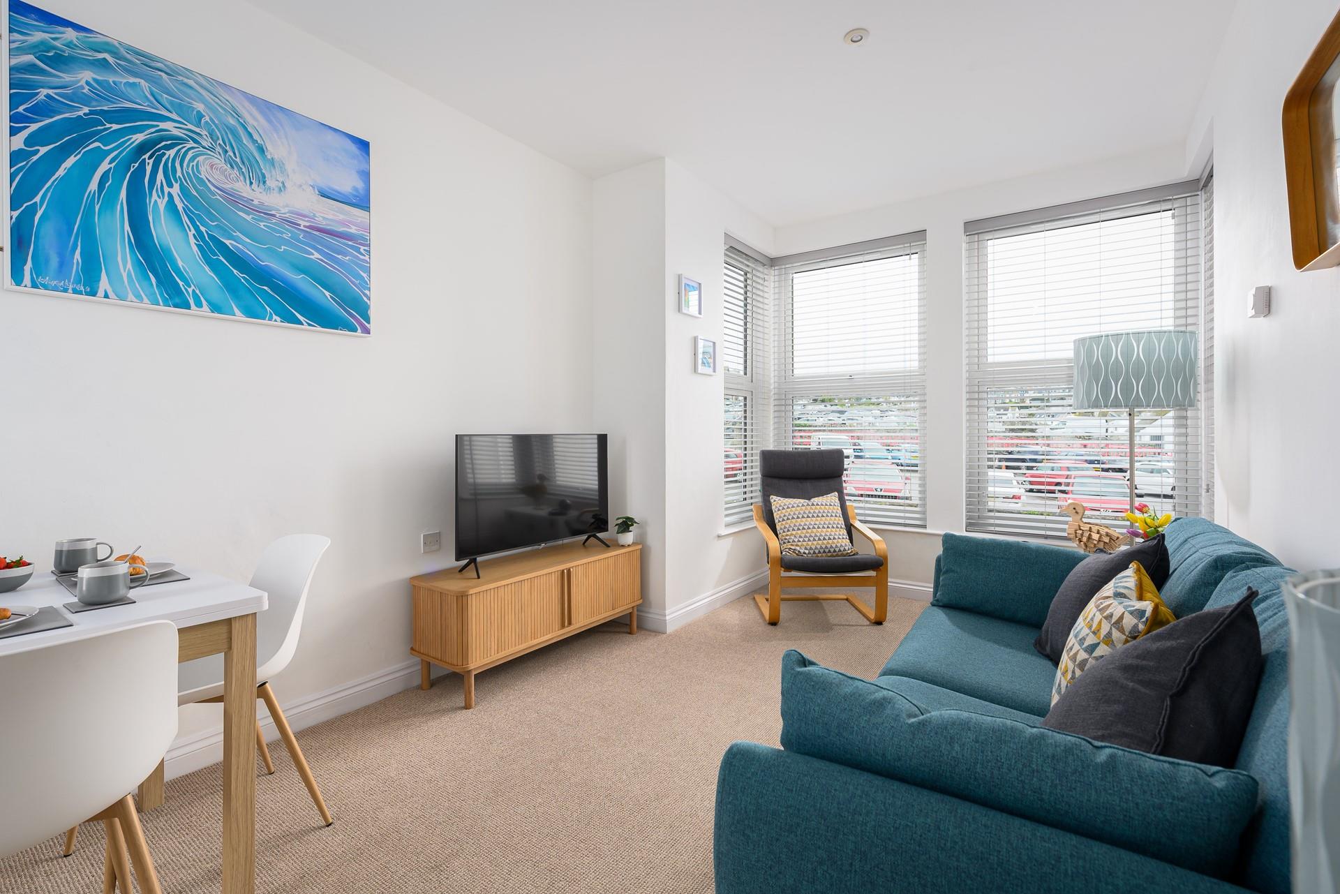 The open plan living space is cosy and light for unwinding in the evening.