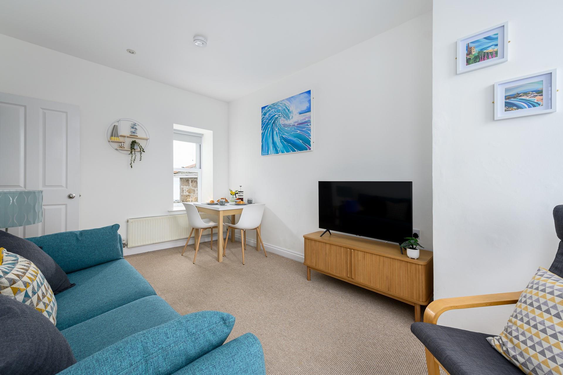 Relax on the sofa in front of a movie after a busy day walking the coast path.