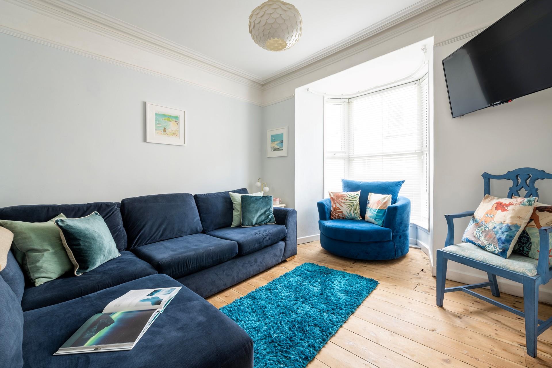 The sitting room is perfect for relaxing evenings after busy days exploring.