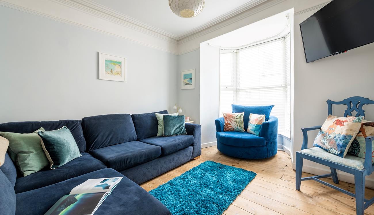 The sitting room is perfect for relaxing evenings after busy days exploring.