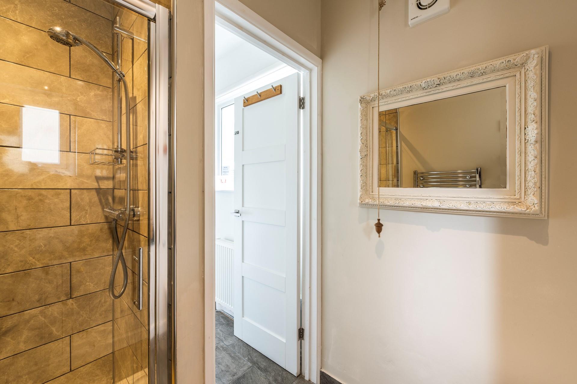 Wash off sandy toes in the shower after a day on the white sandy beach.