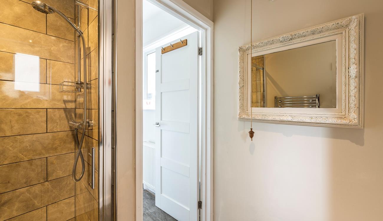 Wash off sandy toes in the shower after a day on the white sandy beach.